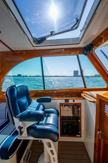 Gracious Yacht Photos Pics Interior of 2018 Hinckley Picnic Boat 37 MKIII with blue seating and ocean view.