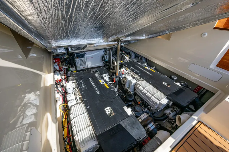 Gracious Yacht Photos Pics Engine compartment of 2018 Hinckley Picnic Boat 37 MKIII, showcasing dual engines and mechanical components.