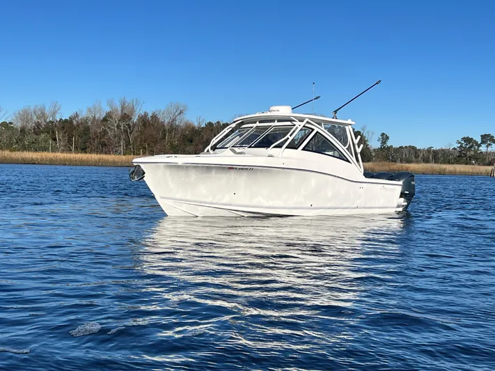  Yacht Photos Pics 2023 Albemarle 31 Dual Console boat on calm water under clear blue sky.