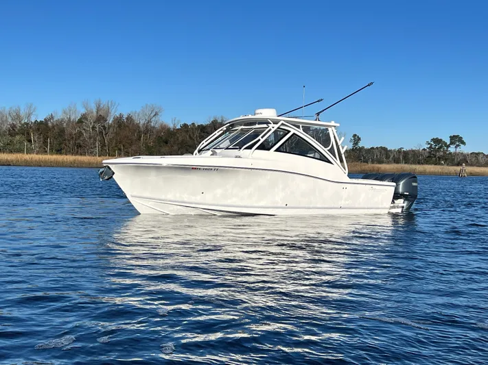  Yacht Photos Pics 2023 Albemarle 31 Dual Console boat on calm water under clear blue sky.