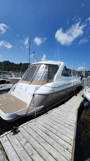  Yacht Photos Pics 2008 Cruisers Yachts 420 Express docked under a clear blue sky.