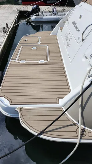  Yacht Photos Pics 2008 Cruisers Yachts 420 Express swim platform with teak decking at marina.
