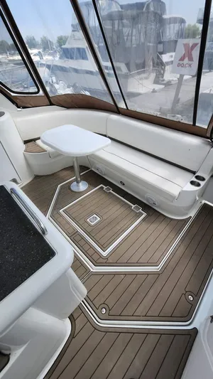  Yacht Photos Pics 2008 Cruisers Yachts 420 Express interior with white seating and wooden flooring.