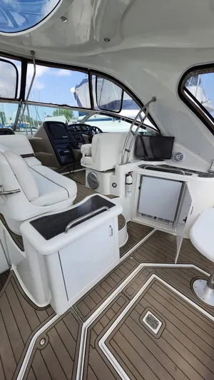  Yacht Photos Pics 2008 Cruisers Yachts 420 Express interior with modern seating and navigation equipment.