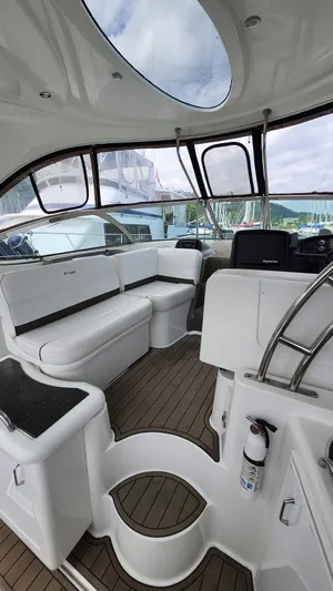  Yacht Photos Pics 2008 Cruisers Yachts 420 Express interior with white seating and wooden flooring.