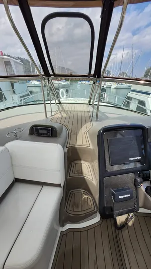  Yacht Photos Pics 2008 Cruisers Yachts 420 Express interior with navigation equipment and seating.