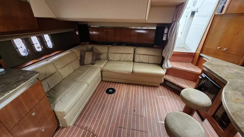  Yacht Photos Pics Luxurious interior of 2008 Cruisers Yachts 420 Express with leather seating and wooden flooring.