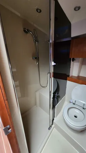  Yacht Photos Pics Bathroom interior of 2008 Cruisers Yachts 420 Express with shower and toilet.