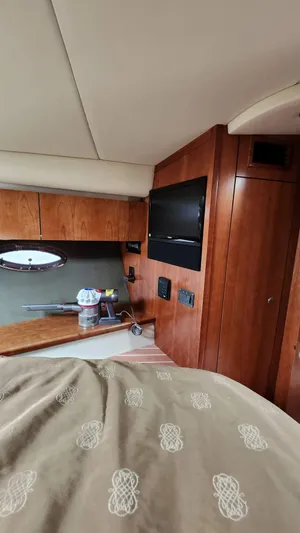  Yacht Photos Pics Interior of 2008 Cruisers Yachts 420 Express with wood paneling and a TV.