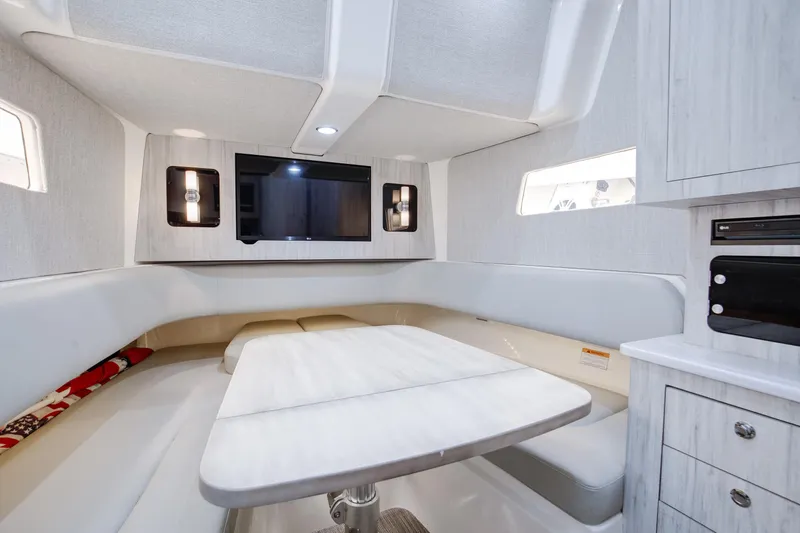  Yacht Photos Pics Luxurious interior of 2021 Regulator 41 boat with modern seating and entertainment system.