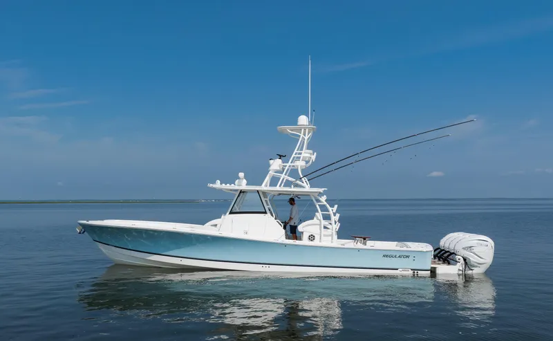  Yacht Photos Pics 2021 Regulator 41 boat on calm water under clear blue sky.