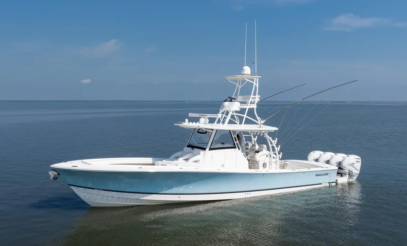 Yacht Photos Pics 2021 Regulator 41 boat on calm water, featuring multiple outboard engines.