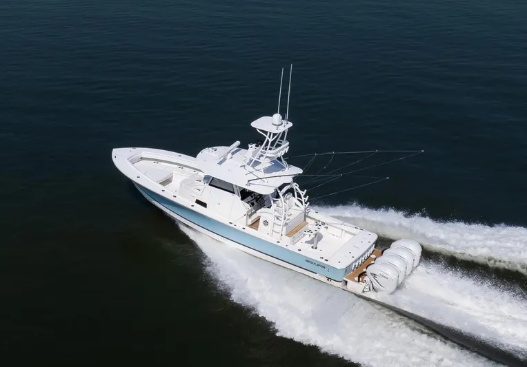  Yacht Photos Pics 2021 Regulator 41 boat cruising on open water, showcasing powerful engines and sleek design.