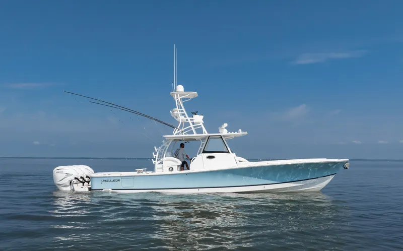  Yacht Photos Pics 2021 Regulator 41 boat on calm water under clear blue sky.