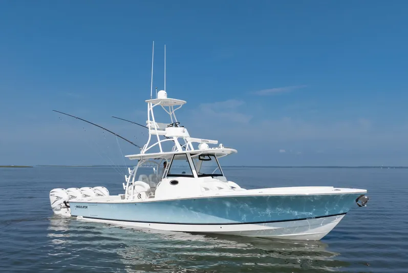  Yacht Photos Pics 2021 Regulator 41 boat on calm water under clear blue sky.