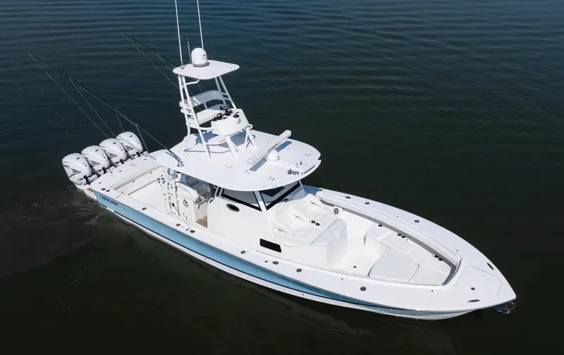  Yacht Photos Pics 2021 Regulator 41 boat with four engines, cruising on calm water.