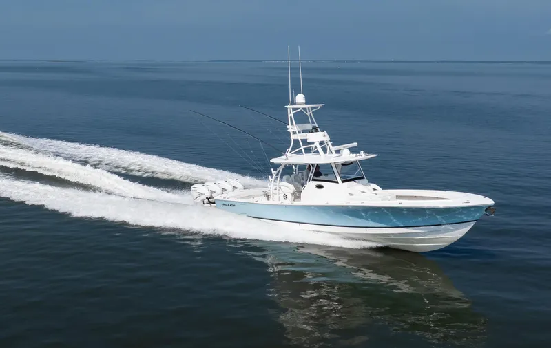  Yacht Photos Pics 2021 Regulator 41 boat cruising on open water, showcasing sleek design and powerful performance.