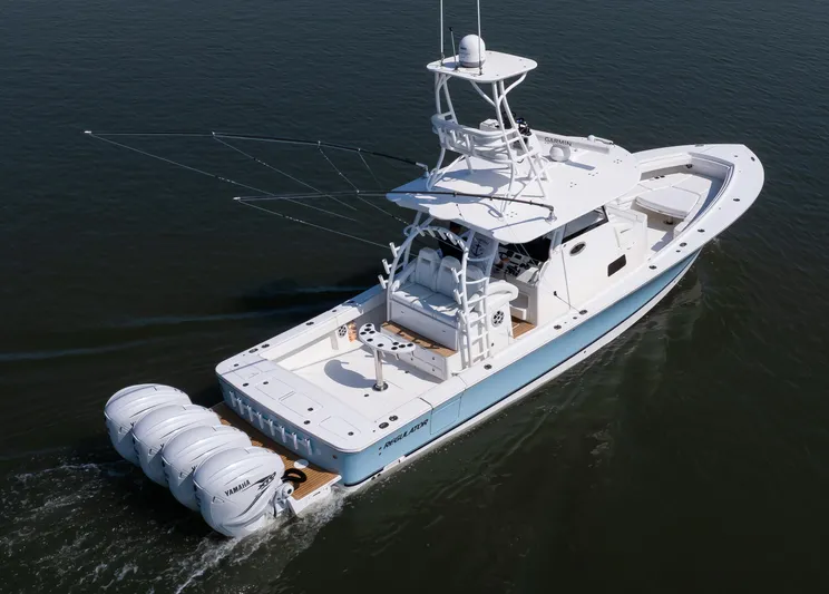  Yacht Photos Pics 2021 Regulator 41 boat with four Yamaha engines cruising on water.