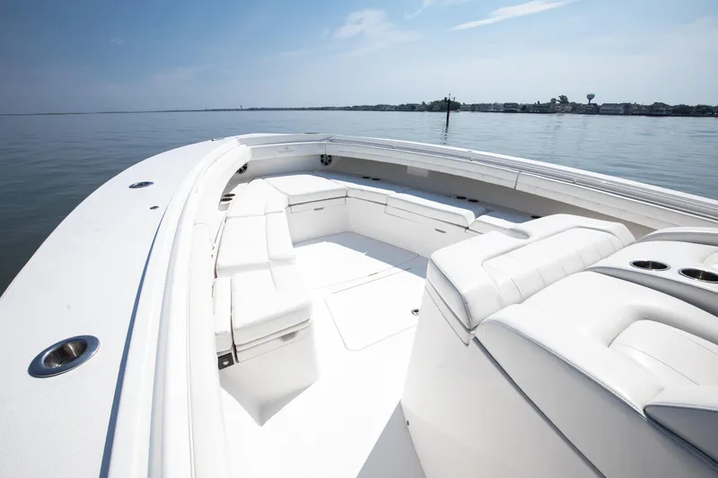  Yacht Photos Pics 2021 Regulator 41 boat with spacious white seating on calm water.