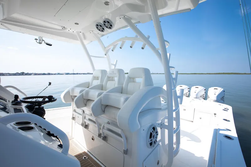  Yacht Photos Pics 2021 Regulator 41 boat interior with white seating and multiple outboard engines.