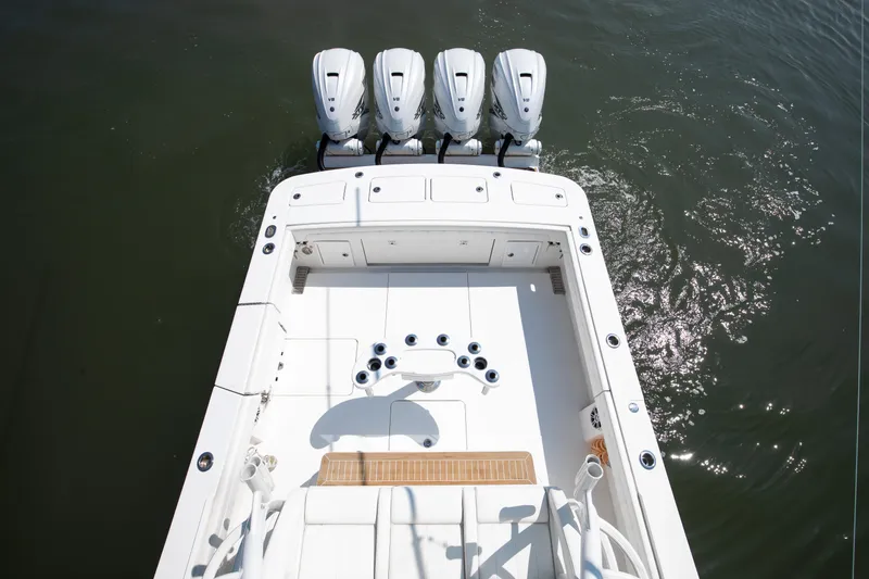  Yacht Photos Pics 2021 Regulator 41 boat with four outboard engines on water.