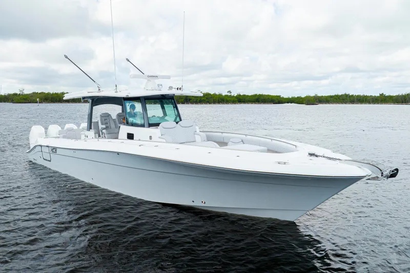  Yacht Photos Pics 2026 HCB 42 Lujo boat on calm water, featuring sleek design and modern amenities.