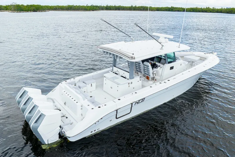  Yacht Photos Pics 2026 HCB 42 Lujo boat on calm water, featuring sleek design and powerful engines.