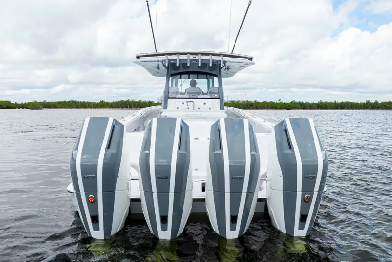  Yacht Photos Pics 2026 HCB 42 Lujo boat with four powerful outboard engines on water.