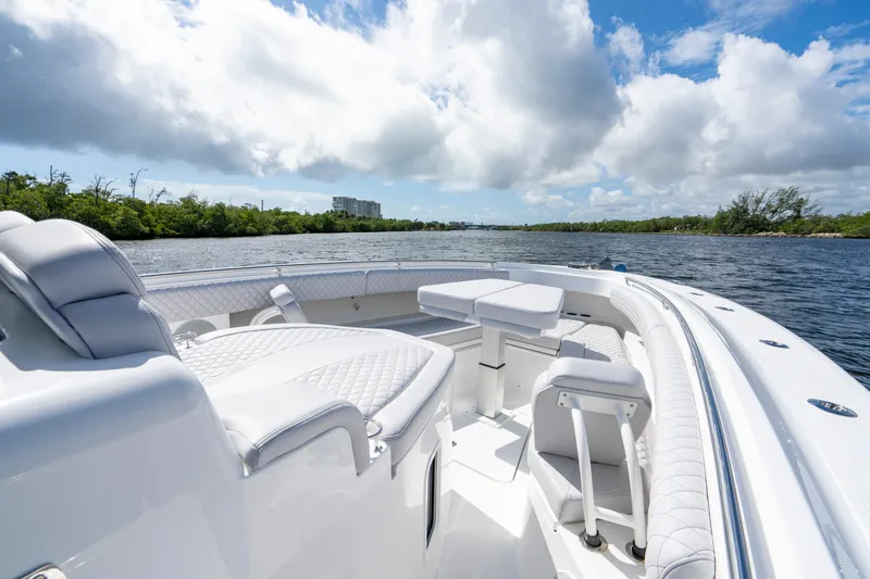  Yacht Photos Pics Luxurious 2026 HCB 42 Lujo boat interior with plush seating on a sunny day.