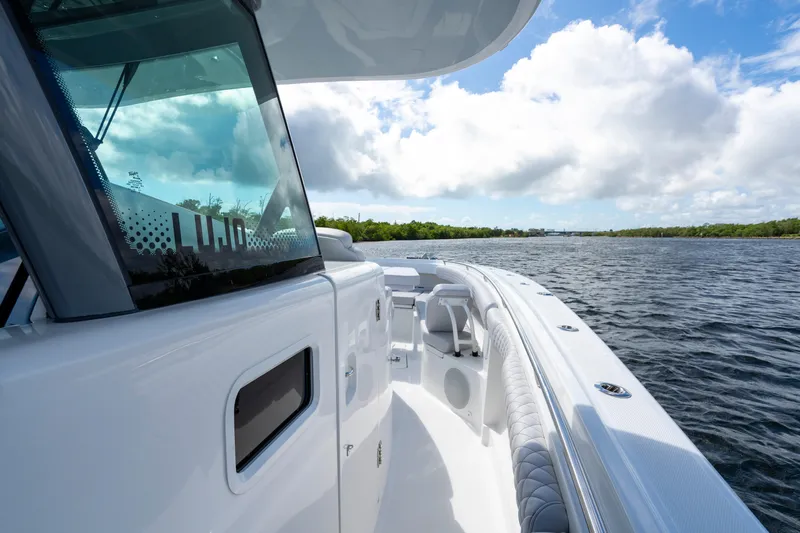  Yacht Photos Pics 2026 HCB 42 Lujo boat cruising on a sunny day with clear skies.