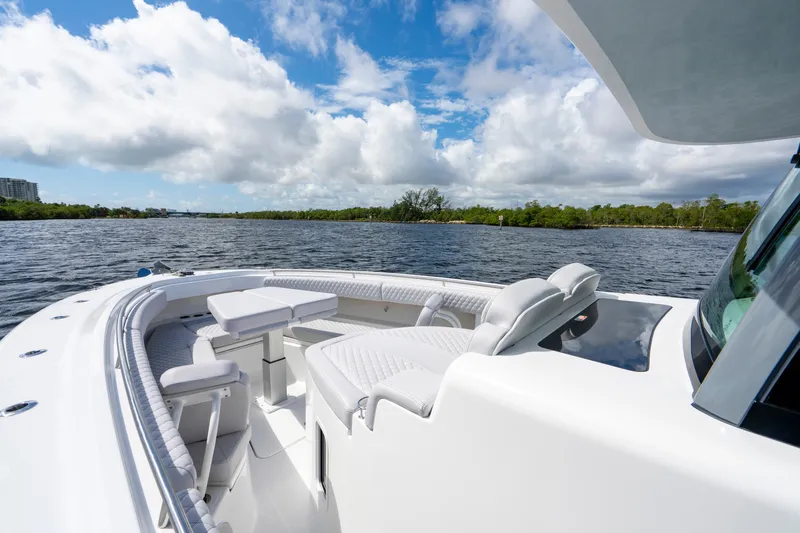  Yacht Photos Pics 2026 HCB 42 Lujo boat on calm water under a partly cloudy sky.