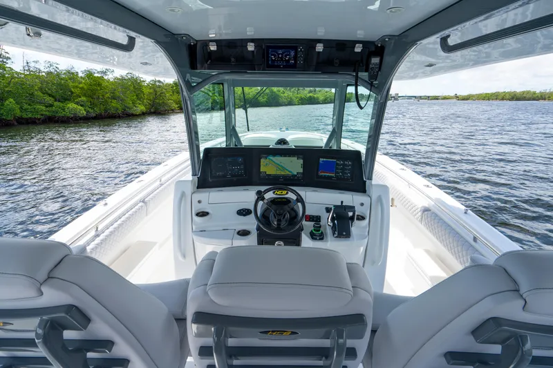 Yacht Photos Pics Helm of 2026 HCB 42 Lujo boat with advanced navigation systems on a scenic waterway.