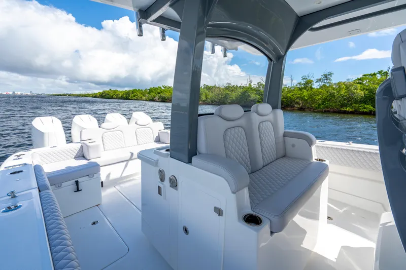  Yacht Photos Pics Luxurious 2026 HCB 42 Lujo boat interior with plush seating and scenic water view.