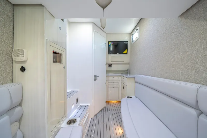  Yacht Photos Pics Luxurious interior of 2026 HCB 42 Lujo yacht with modern seating and kitchenette.