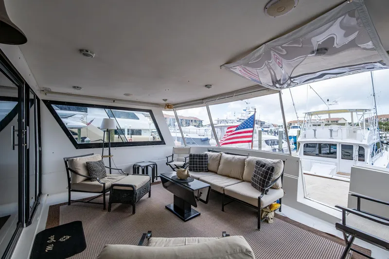 Mi Jule Yacht Photos Pics Luxurious 1991 Viking 65 Motor Yacht interior with comfortable seating and marina view.