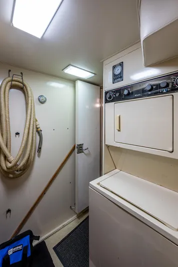 Mi Jule Yacht Photos Pics Laundry area inside 1991 Viking 65 Motor Yacht with washer and dryer.
