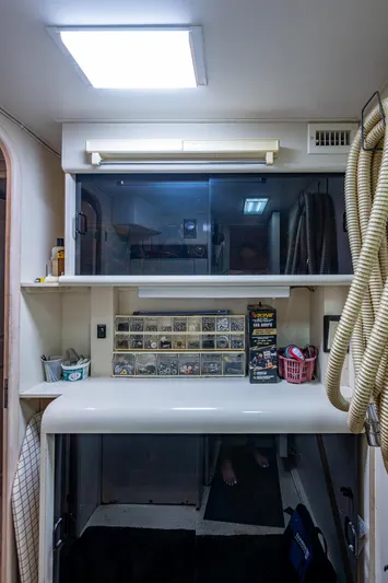 Mi Jule Yacht Photos Pics Interior of 1991 Viking 65 Motor Yacht with storage shelves and organized compartments.