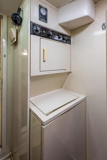 Mi Jule Yacht Photos Pics Laundry area inside 1991 Viking 65 Motor Yacht with washer and dryer.