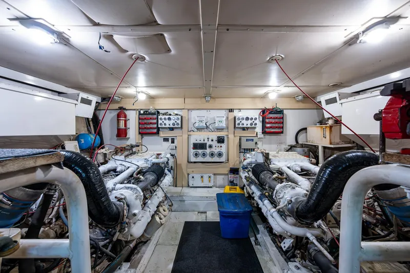 Mi Jule Yacht Photos Pics Engine room of a 1991 Viking 65 Motor Yacht, featuring dual engines and control panels.