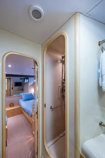 Mi Jule Yacht Photos Pics Interior of 1991 Viking 65 Motor Yacht showing bedroom and compact bathroom.