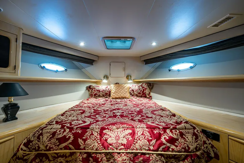 Mi Jule Yacht Photos Pics Luxurious bedroom interior of 1991 Viking 65 Motor Yacht with elegant red bedding.