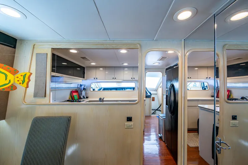Mi Jule Yacht Photos Pics Interior of 1991 Viking 65 Motor Yacht, featuring modern kitchen and seating area.