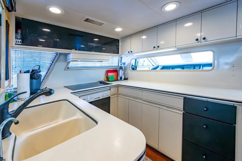 Mi Jule Yacht Photos Pics Spacious kitchen in 1991 Viking 65 Motor Yacht with modern amenities and ample storage.