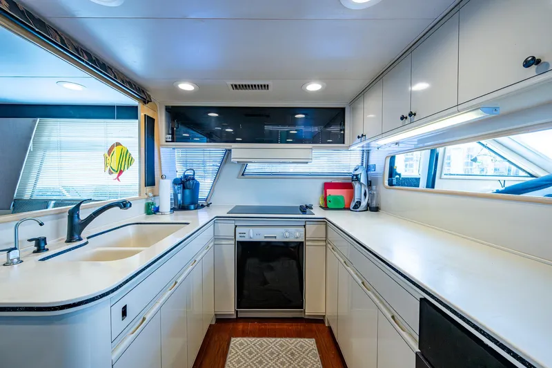 Mi Jule Yacht Photos Pics Spacious kitchen in 1991 Viking 65 Motor Yacht with modern appliances and ample counter space.