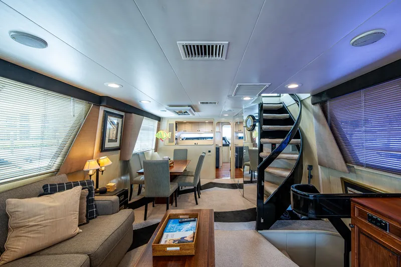 Mi Jule Yacht Photos Pics Luxurious interior of a 1991 Viking 65 Motor Yacht with elegant furnishings and spiral staircase.