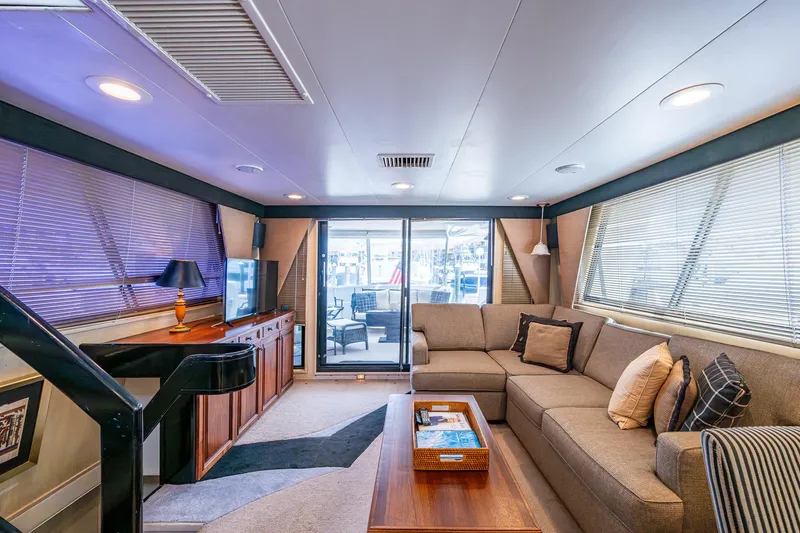 Mi Jule Yacht Photos Pics Luxurious interior of 1991 Viking 65 Motor Yacht with cozy seating and elegant decor.