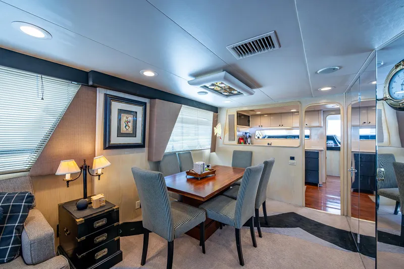 Mi Jule Yacht Photos Pics Luxurious interior of 1991 Viking 65 Motor Yacht with elegant dining area and modern decor.