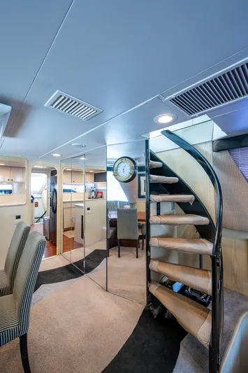 Mi Jule Yacht Photos Pics Interior of 1991 Viking 65 Motor Yacht with spiral staircase and modern furnishings.