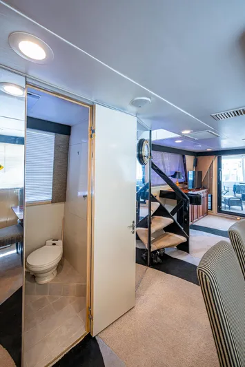 Mi Jule Yacht Photos Pics Interior of 1991 Viking 65 Motor Yacht featuring bathroom, staircase, and seating area.