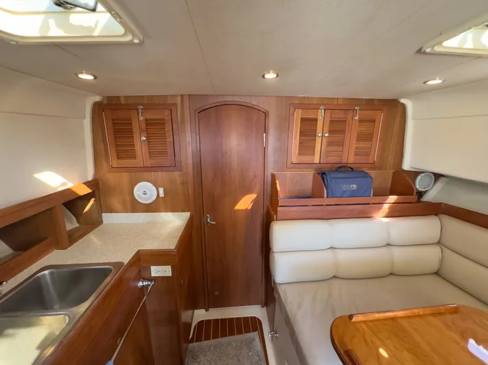 Bay Cruzin Yacht Photos Pics Interior of a 2004 Mainship Pilot 34 yacht with wooden furnishings.